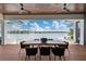 Spacious patio with dining table and chairs, overlooking the water at 535 70Th St, Holmes Beach, FL 34217