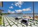 Luxury pool and patio with modern lounge chairs and water views at 535 70Th St, Holmes Beach, FL 34217