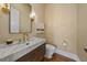 Stylish powder room with marble vanity and patterned walls at 535 70Th St, Holmes Beach, FL 34217