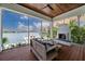 Relaxing screened porch with fireplace and water views at 535 70Th St, Holmes Beach, FL 34217