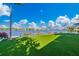 Scenic waterfront view with lush green lawn and beautiful homes at 535 70Th St, Holmes Beach, FL 34217