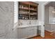 Wet bar with wood shelving, wine storage, and white quartz countertop at 535 70Th St, Holmes Beach, FL 34217