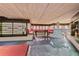 Impressive wine cellar with extensive shelving, a tasting bar, and seating at 535 70Th St, Holmes Beach, FL 34217