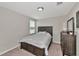 Charming bedroom with a queen bed and plenty of natural light at 17009 Peaceful Valley Dr, Wimauma, FL 33598