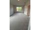 Spacious bedroom with neutral carpet and large window at 1590 Royal Rd, Venice, FL 34293