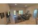 Comfortable living room with modern furnishings, neutral colors, and natural light at 1590 Royal Rd, Venice, FL 34293