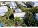 Aerial view of home nestled in tropical neighborhood at 106 11Th S St # A, Bradenton Beach, FL 34217