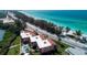 Aerial view of condo building with oceanfront pool at 106 11Th S St # A, Bradenton Beach, FL 34217