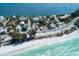 Aerial view of beachfront property with coastal road at 106 11Th S St # A, Bradenton Beach, FL 34217