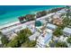 Aerial view of beachfront property, showcasing a charming house and the beautiful ocean at 106 11Th S St # A, Bradenton Beach, FL 34217