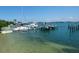 Boats docked at a marina on a sunny day at 106 11Th S St # A, Bradenton Beach, FL 34217