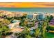 Luxury beachfront property aerial view at sunset at 2251 Gulf Of Mexico Dr # 204, Longboat Key, FL 34228