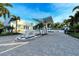 Modern gated entrance to the exclusive community at 2251 Gulf Of Mexico Dr # 204, Longboat Key, FL 34228