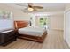 Bedroom with wood flooring and backyard access at 916 69Th W Ave, Bradenton, FL 34207