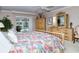 Main bedroom with king bed and pool view at 7812 Broadmoor Pines Blvd, Sarasota, FL 34243