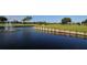 Picturesque golf course with water features and fountain at 7812 Broadmoor Pines Blvd, Sarasota, FL 34243