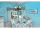 Charming breakfast nook with glass-top table and pool view at 7812 Broadmoor Pines Blvd, Sarasota, FL 34243