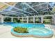 Inviting screened pool and spa with a covered patio at 7812 Broadmoor Pines Blvd, Sarasota, FL 34243