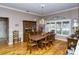 Bright dining room with hardwood floors, a chandelier, and large window at 7812 Broadmoor Pines Blvd, Sarasota, FL 34243