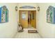 Inviting entryway with double doors and golf course decor at 7812 Broadmoor Pines Blvd, Sarasota, FL 34243