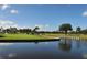 Scenic view of golf course with water feature at 7812 Broadmoor Pines Blvd, Sarasota, FL 34243