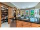 Kitchen features a large island, pantry, and stainless steel appliances at 1130 Anclote Rd, Tarpon Springs, FL 34689