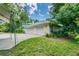 Three-car garage with additional space for storage and equipment at 1130 Anclote Rd, Tarpon Springs, FL 34689