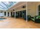 Covered patio with seating area overlooking the pool and spa at 1130 Anclote Rd, Tarpon Springs, FL 34689