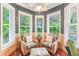 Relaxing sitting area with wicker chairs and natural light at 1130 Anclote Rd, Tarpon Springs, FL 34689