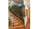 Impressive wooden staircase featuring a captivating landscape mural at 1130 Anclote Rd, Tarpon Springs, FL 34689