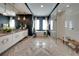 Spa-like bathroom with herringbone tile floor, soaking tub, and walk-in shower at 640 N Owl Dr, Sarasota, FL 34236