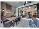 Outdoor kitchen with stainless steel appliances and dining area at 640 N Owl Dr, Sarasota, FL 34236