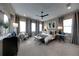 Large main bedroom with sitting area and neutral color scheme at 640 N Owl Dr, Sarasota, FL 34236