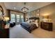 Spacious bedroom with plush carpet, large windows, and a sitting area at 640 N Owl Dr, Sarasota, FL 34236