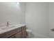 Simple and modern bathroom with gray vanity and white countertop at 6009 White Mangrove Ln, Bradenton, FL 34210