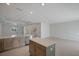 Modern kitchen with gray cabinets, stainless steel appliances, and an island at 6009 White Mangrove Ln, Bradenton, FL 34210