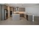 Modern kitchen with gray cabinets, stainless steel appliances, and an island at 6009 White Mangrove Ln, Bradenton, FL 34210