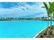Stunning view of a lagoon pool and sandy beach at 6009 White Mangrove Ln, Bradenton, FL 34210