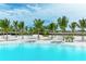 White sand beach area with palm trees and lagoon view at 6009 White Mangrove Ln, Bradenton, FL 34210