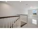 Modern white staircase with dark wood accents at 6009 White Mangrove Ln, Bradenton, FL 34210