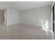 Spacious living area with tile flooring and sliding glass doors at 6009 White Mangrove Ln, Bradenton, FL 34210