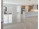Open concept kitchen with island, stainless steel appliances, and white quartz countertops at 6009 White Mangrove Ln, Bradenton, FL 34210