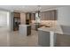 Modern kitchen with gray cabinets, stainless steel appliances, and an island at 6009 White Mangrove Ln, Bradenton, FL 34210