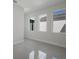 Bright bedroom with three windows and tile floors at 6009 White Mangrove Ln, Bradenton, FL 34210
