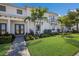 Modern townhome exterior showcasing landscaping and walkway at 6009 White Mangrove Ln, Bradenton, FL 34210