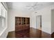 Hardwood floor bedroom with built-in shelving and access to bathroom at 3603 N Point Rd # 202, Osprey, FL 34229