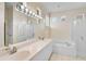 Bathroom featuring double sinks and a soaking tub at 4063 Caddie E Dr, Bradenton, FL 34203
