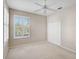 Bedroom with light beige walls, white trim, and a ceiling fan at 4063 Caddie E Dr, Bradenton, FL 34203