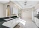 Bright kitchen with white cabinets, black countertops, and stainless steel appliances at 4063 Caddie E Dr, Bradenton, FL 34203