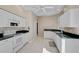Bright kitchen with white cabinets and black countertops at 4063 Caddie E Dr, Bradenton, FL 34203